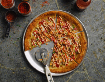 De Beste Hot Sauce voor Pizza: Een Pittige Twist aan je Slices